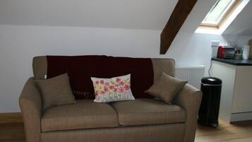 Apartment, 1 Bedroom | Living area | Flat-screen TV