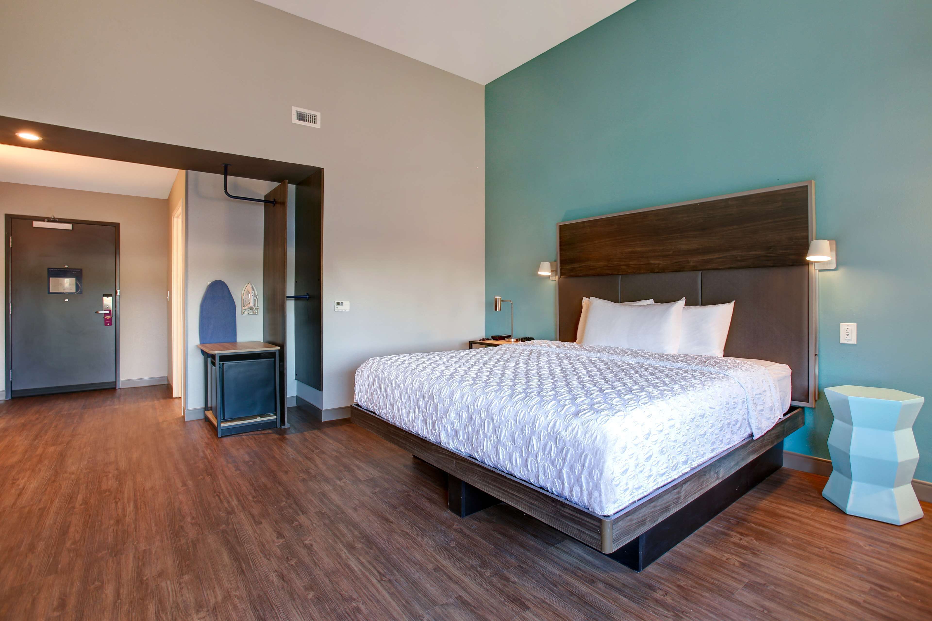 desk, laptop workspace, blackout curtains, iron/ironing board