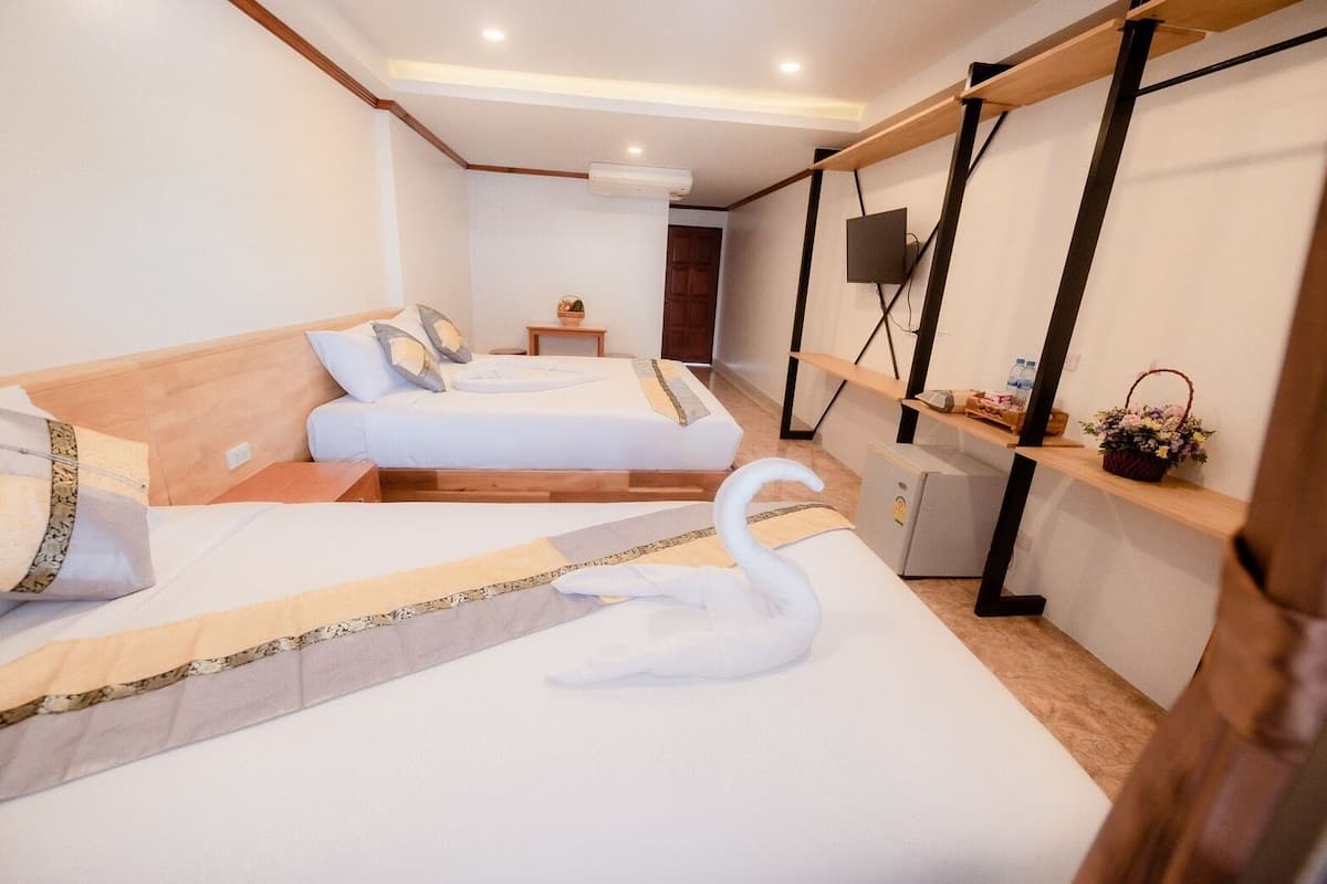 Habitación Deluxe | Cortinas blackout, wifi gratis y ropa de cama