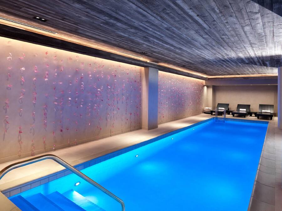 Indoor pool, open 6:00 AM to 9:00 PM, pool loungers