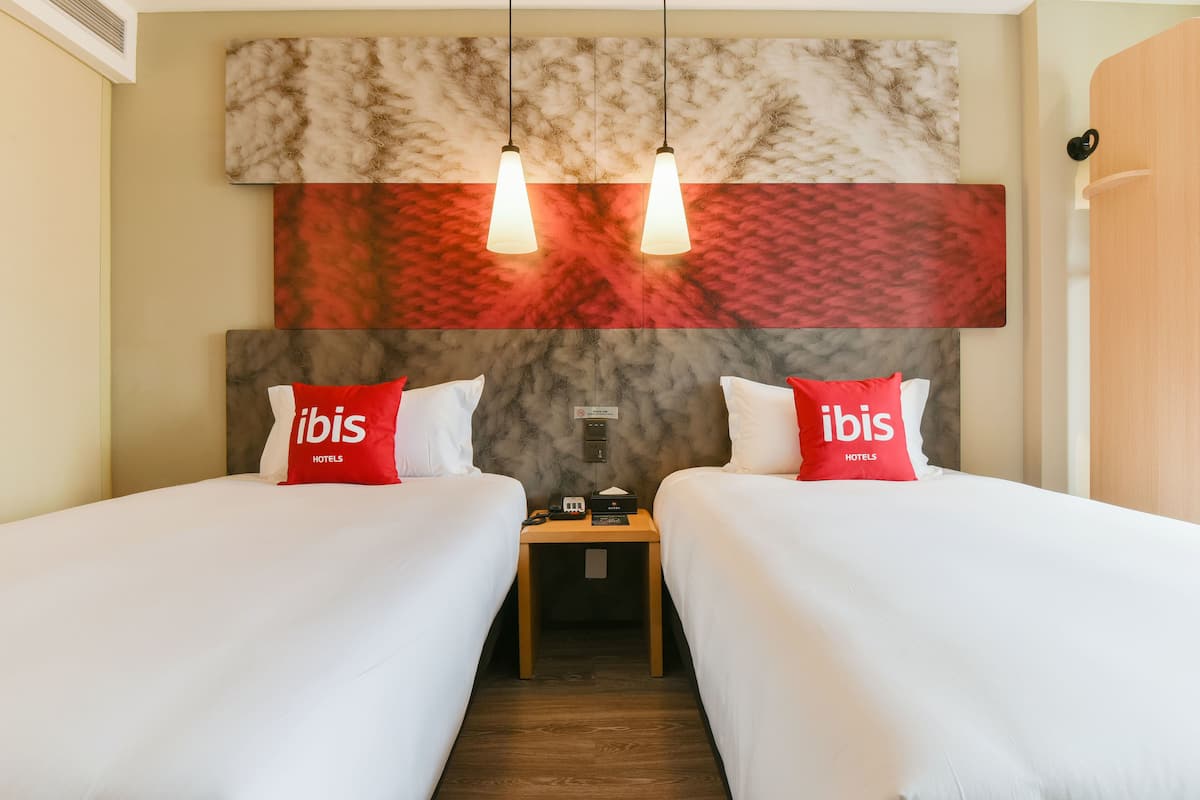 Premium bedding, memory-foam beds, desk, laptop workspace