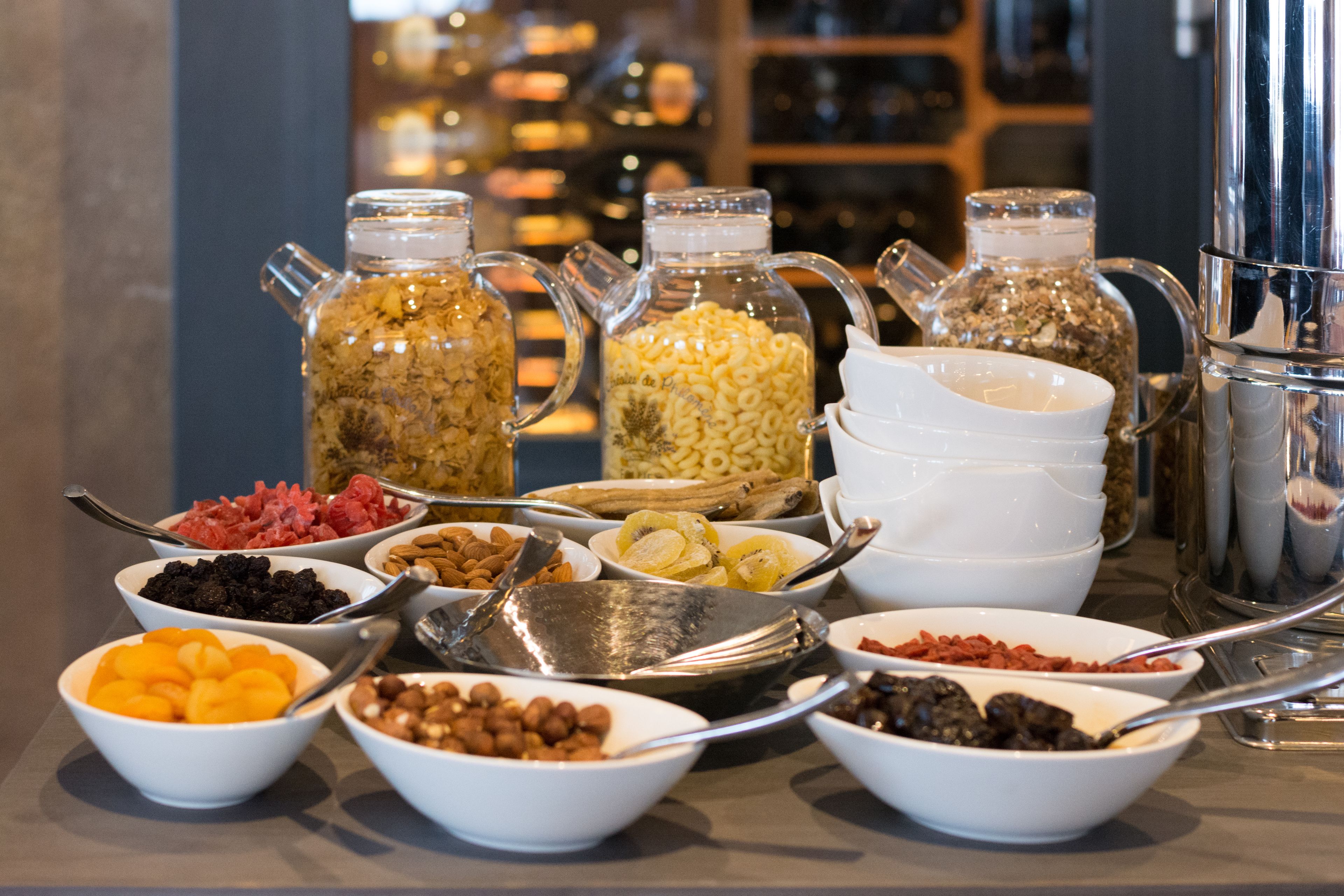 A buffet with various food items and condiments.