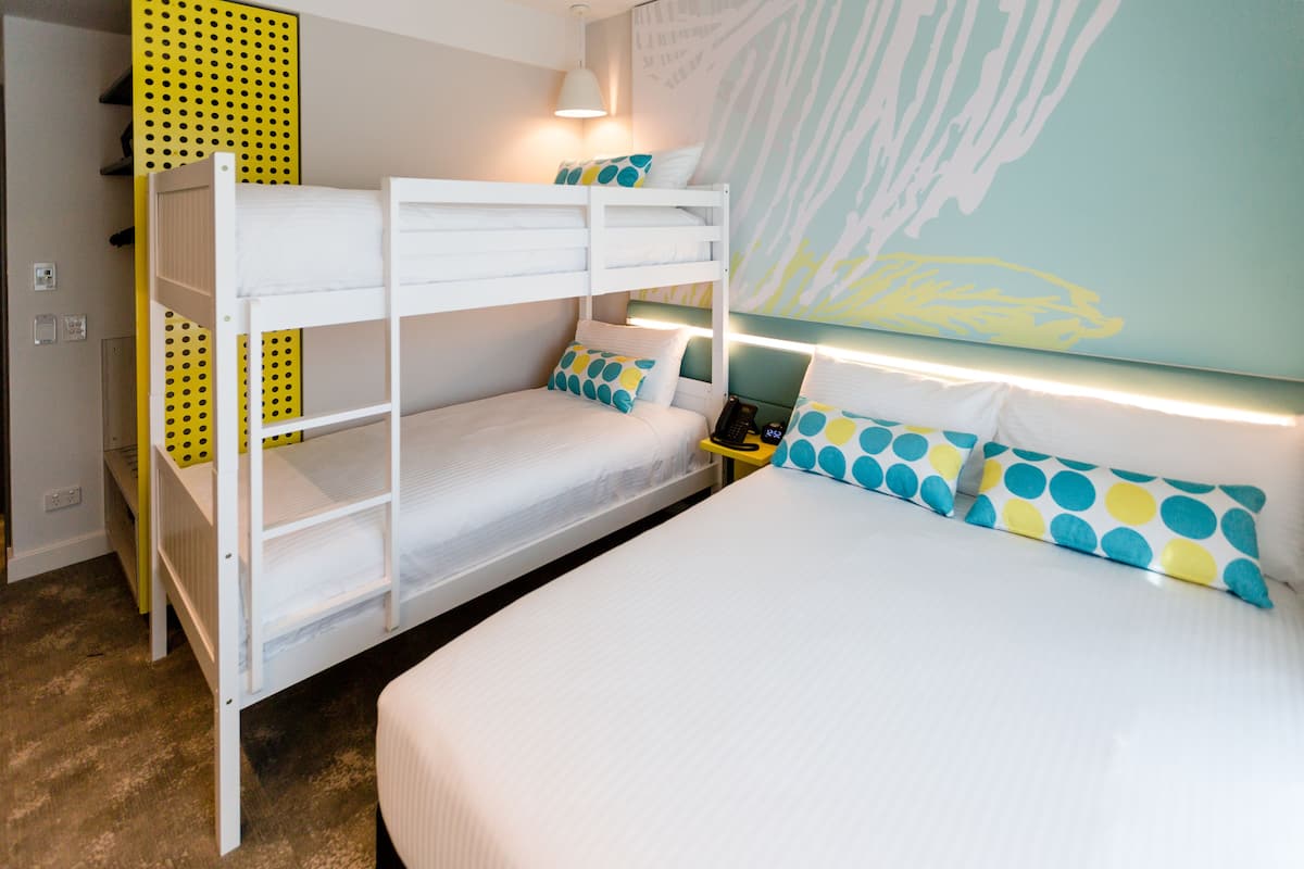 Family Room | Minibar, in-room safe, desk, blackout drapes