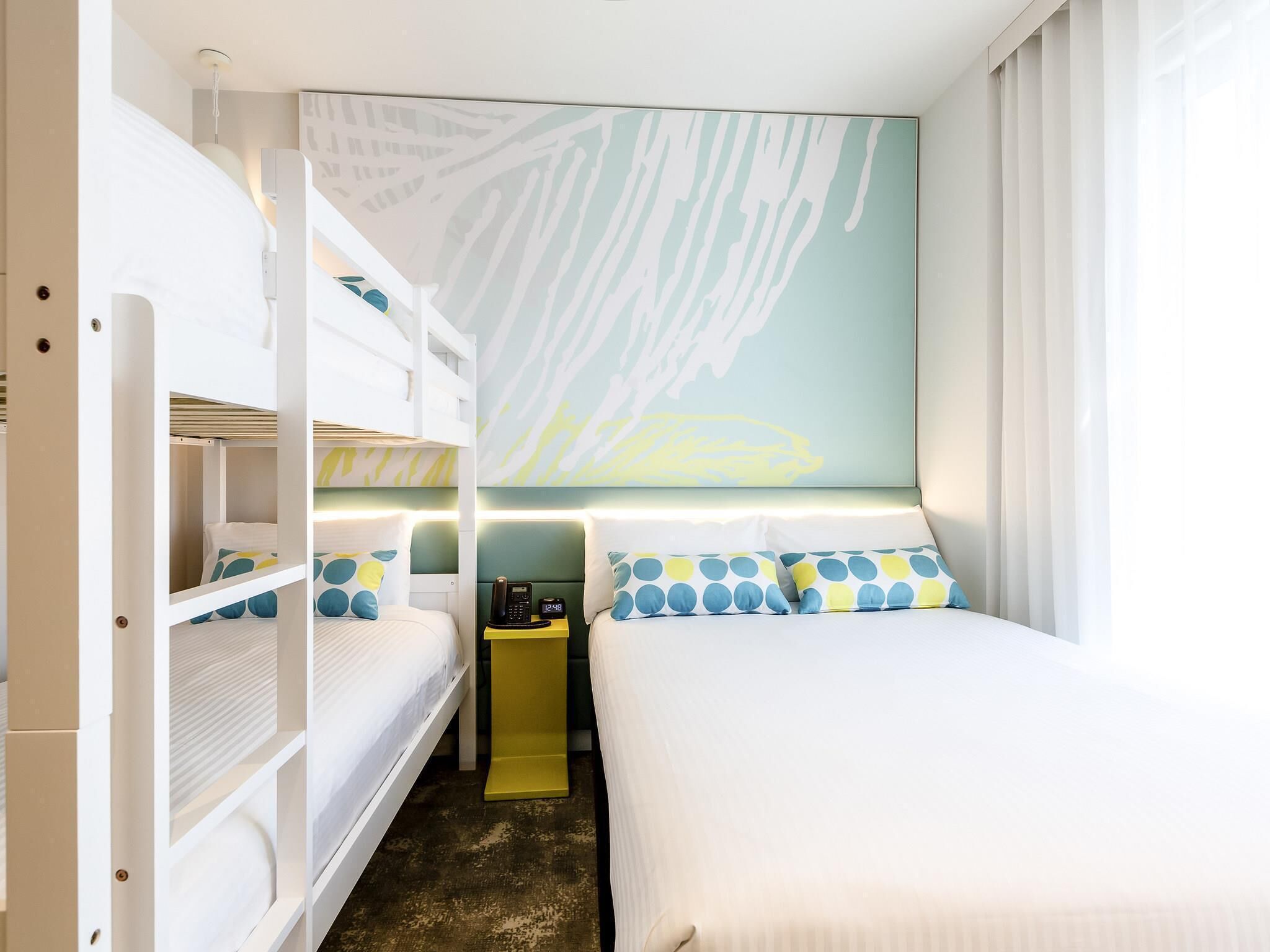 Family Room | Minibar, in-room safe, desk, blackout drapes