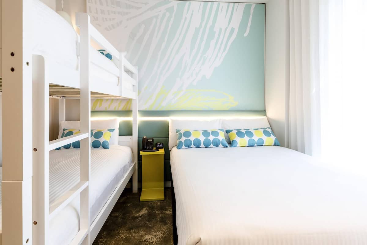 Family Room | Minibar, in-room safe, desk, blackout drapes
