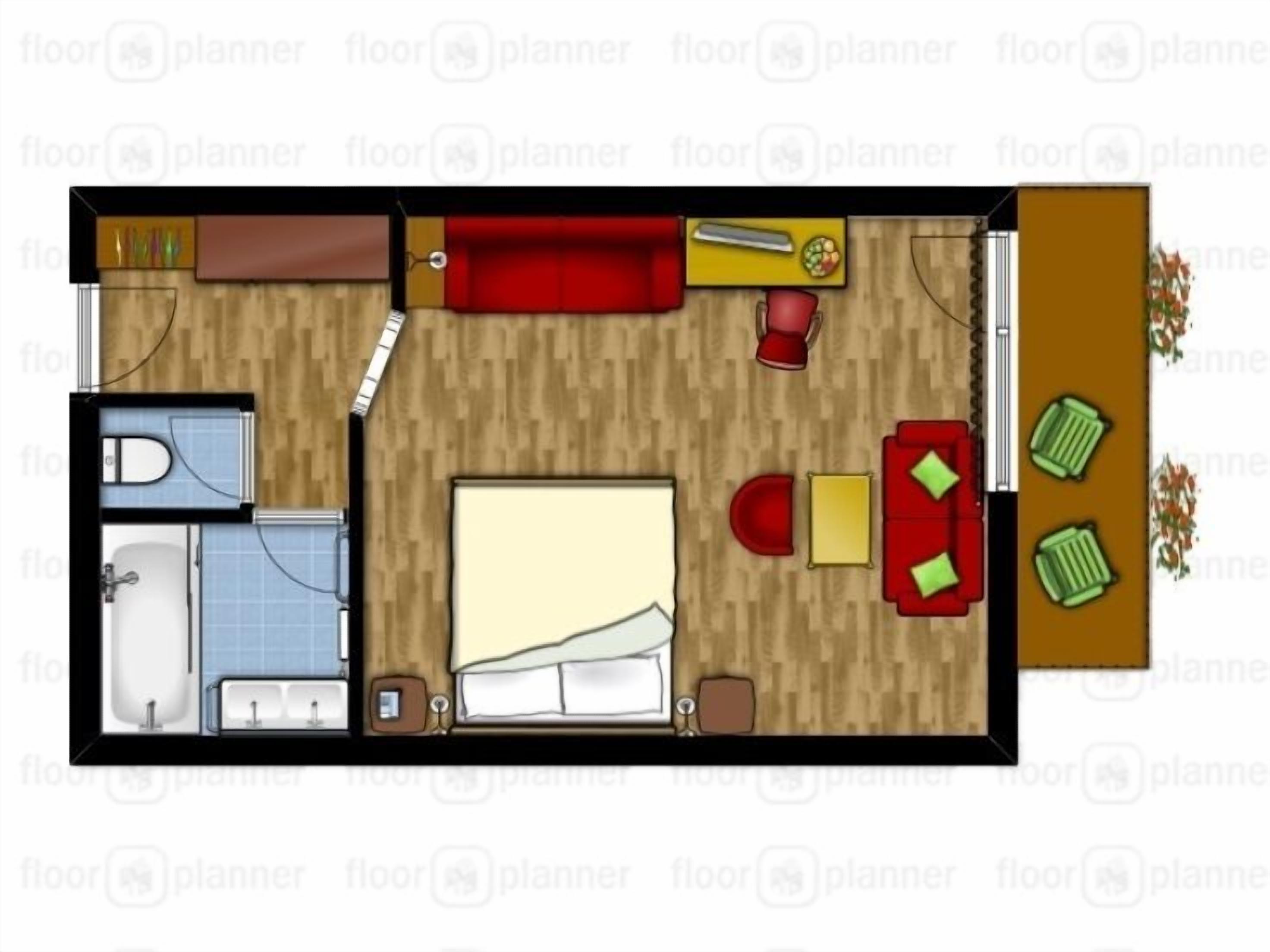A bedroom with a bed, bedside table, and a small window.