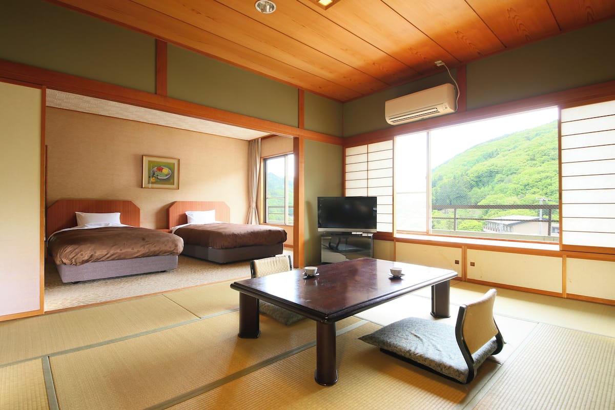 Quarto standard, para não fumantes (Japanese-Western-Style Indoor Bath) | Roupa de cama