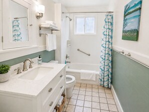 Combined shower/tub, hair dryer, towels, soap