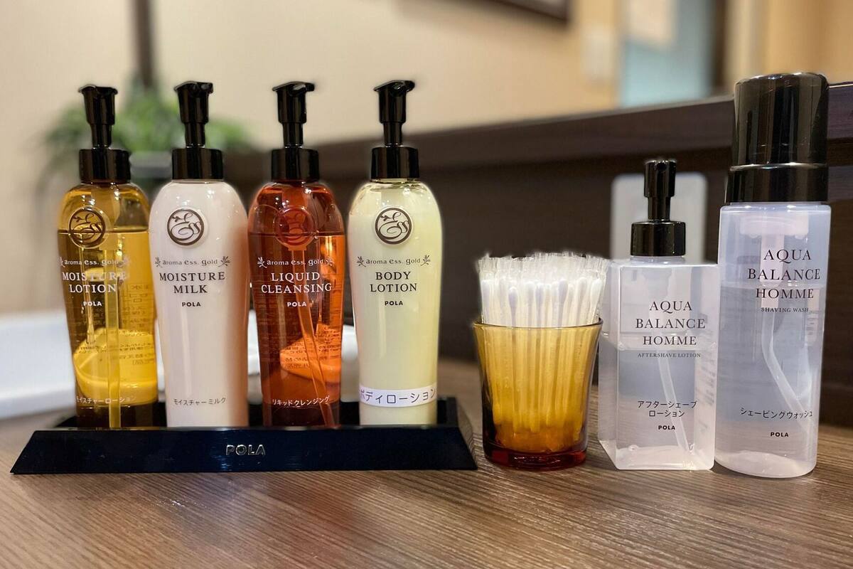 A collection of personal care products on a wooden surface.