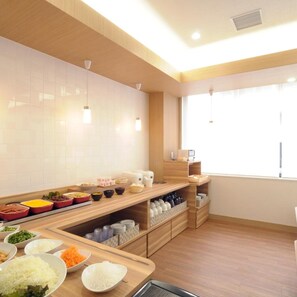 A modern kitchen with white tiles, wooden countertops, and a variety of food items. - Ab Hotel Omihachiman (Omihachiman)