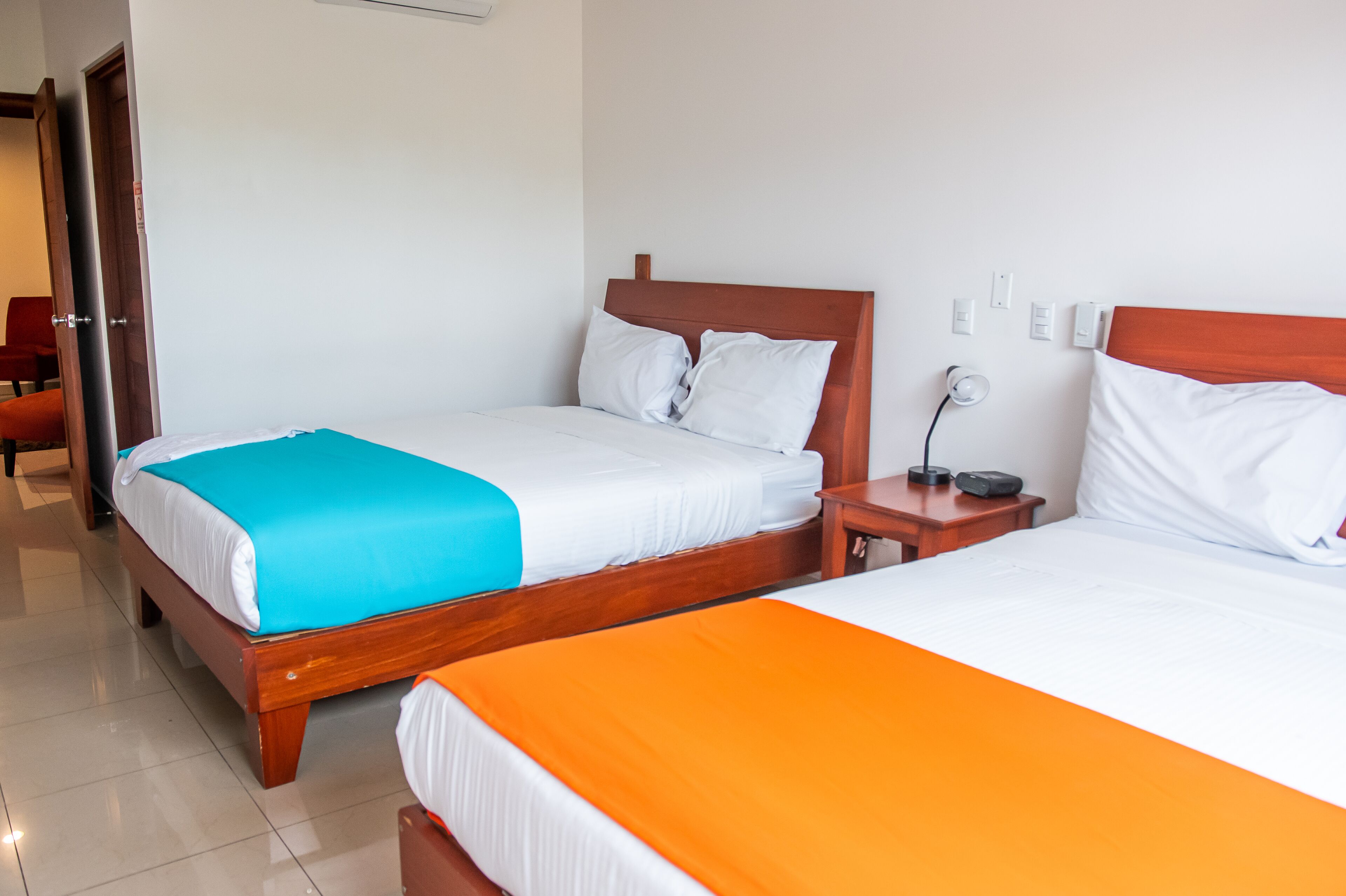 family quadruple room | down duvets, desk, laptop workspace, blackout curtains