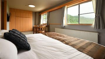 Deluxe Room | Down comforters, desk, laptop workspace, free WiFi