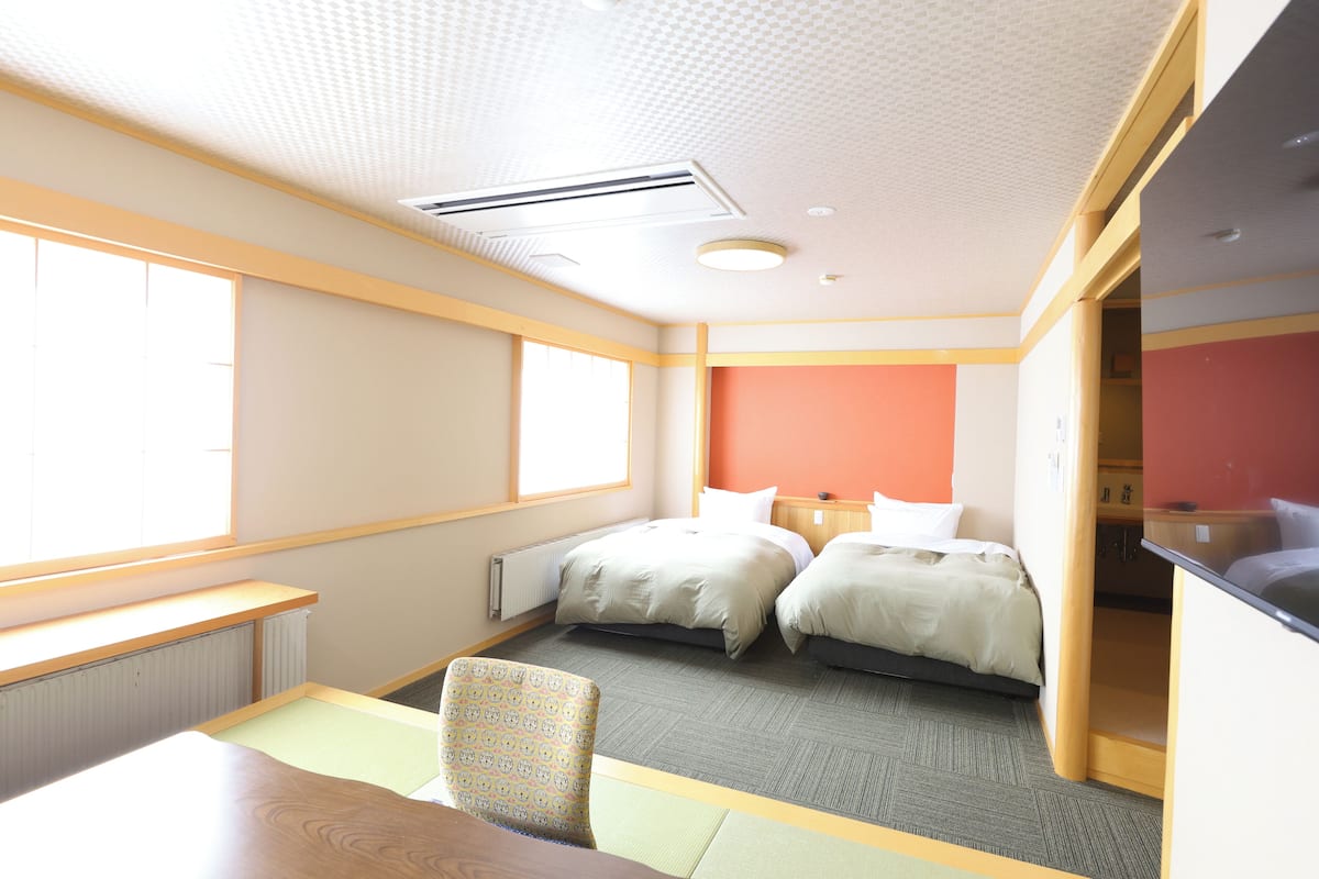 Deluxe Room | Down comforters, desk, laptop workspace, free WiFi