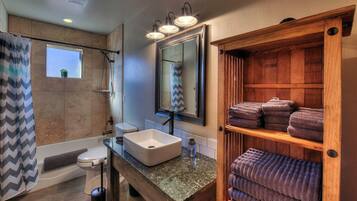 Combined shower/tub, hair dryer, towels, soap