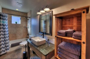Combined shower/tub, hair dryer, towels, soap