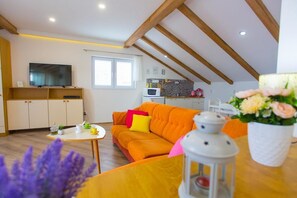 Comfort Apartment, Sea View | Living area | Flat-screen TV