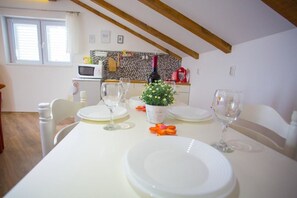 Comfort Apartment, Sea View | Private kitchen | Fridge, microwave, oven, stovetop