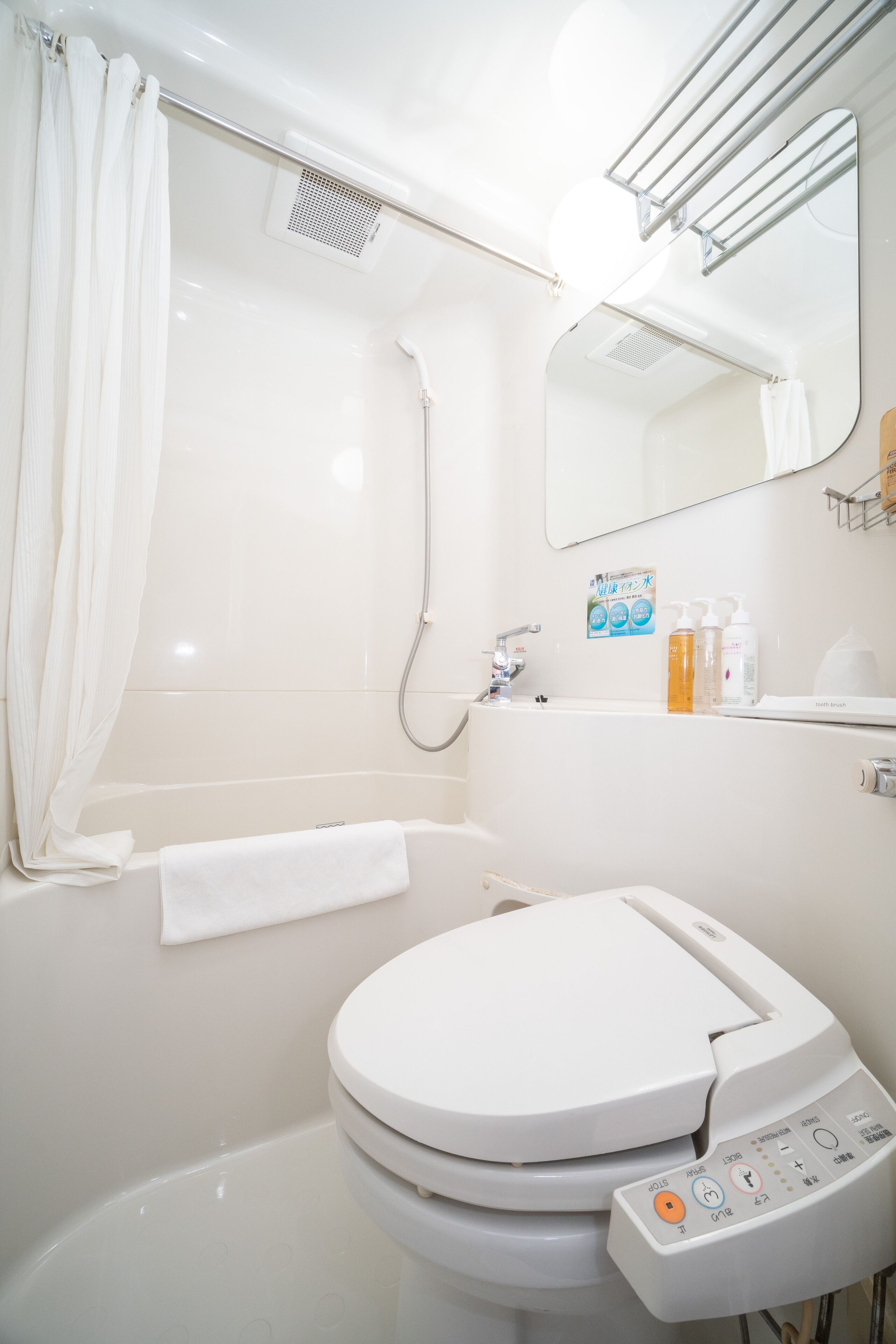 combined shower/bathtub, free toiletries, hair dryer, slippers
