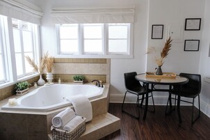 Deluxe Room, 1 King Bed (3) | Bathroom | Separate tub and shower, deep soaking tub, rainfall showerhead