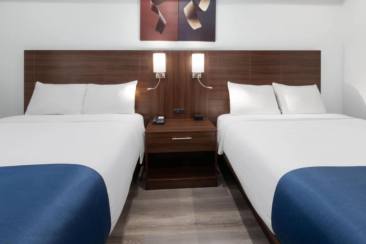 Down duvets, pillow-top beds, desk, blackout curtains