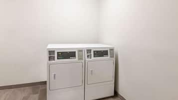 A laundry area with two stacked front-loading washing machines.