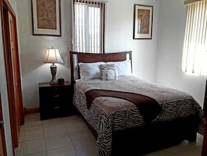 Family Condo, 2 Queen Beds, Courtyard View | 2 bedrooms, laptop workspace, iron/ironing board, free WiFi