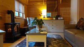 Deluxe Chalet | Living area | 50-inch Smart TV with digital channels, fireplace, MP3 dock - Meadow View Apartments (Newquay)