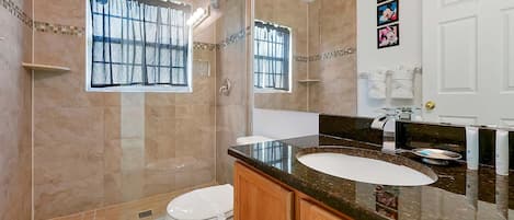 Combined shower/tub, hair dryer, towels, soap