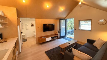 Classic Cabin, 1 Queen Bed with Sofa bed, Courtyard View (C7) | Living area | 42-inch Smart TV with digital channels