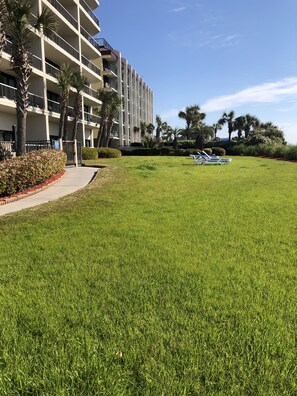 Stroll through the lush grounds to the contemporary building with spacious balconies and a clean design.