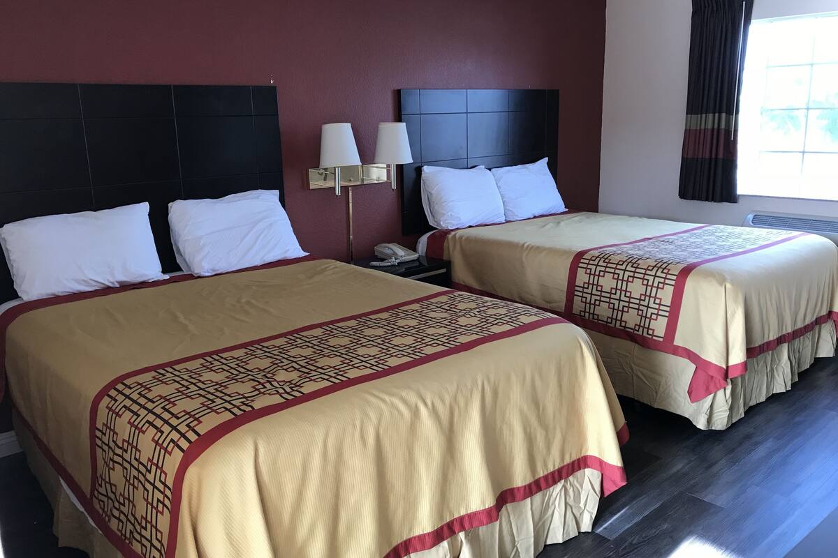 Standard Room, 2 Queen Beds | Desk, laptop workspace, WiFi (free), bed sheets