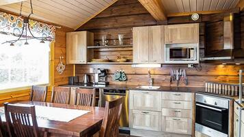 A kitchen with wooden cabinets, a microwave, a coffee maker, and a dishwasher.