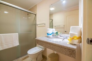 Shower, towels, shampoo, toilet paper
