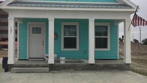 A small, single-story house with a front porch, a mailbox, and a 'For Rent' sign. - Cottage by the beach ! Short 120 steps to the beach and its beautiful waiting ! (Mexico Beach)