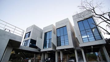 Contemporary living space with clean lines, large windows, and outdoor areas.
