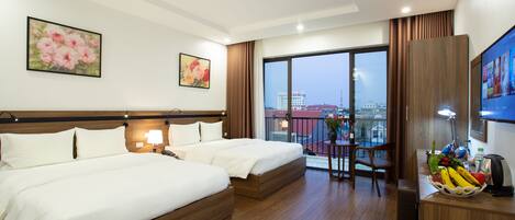 Deluxe Quadruple Room, Balcony, City View | Minibar, in-room safe, individually decorated, individually furnished
