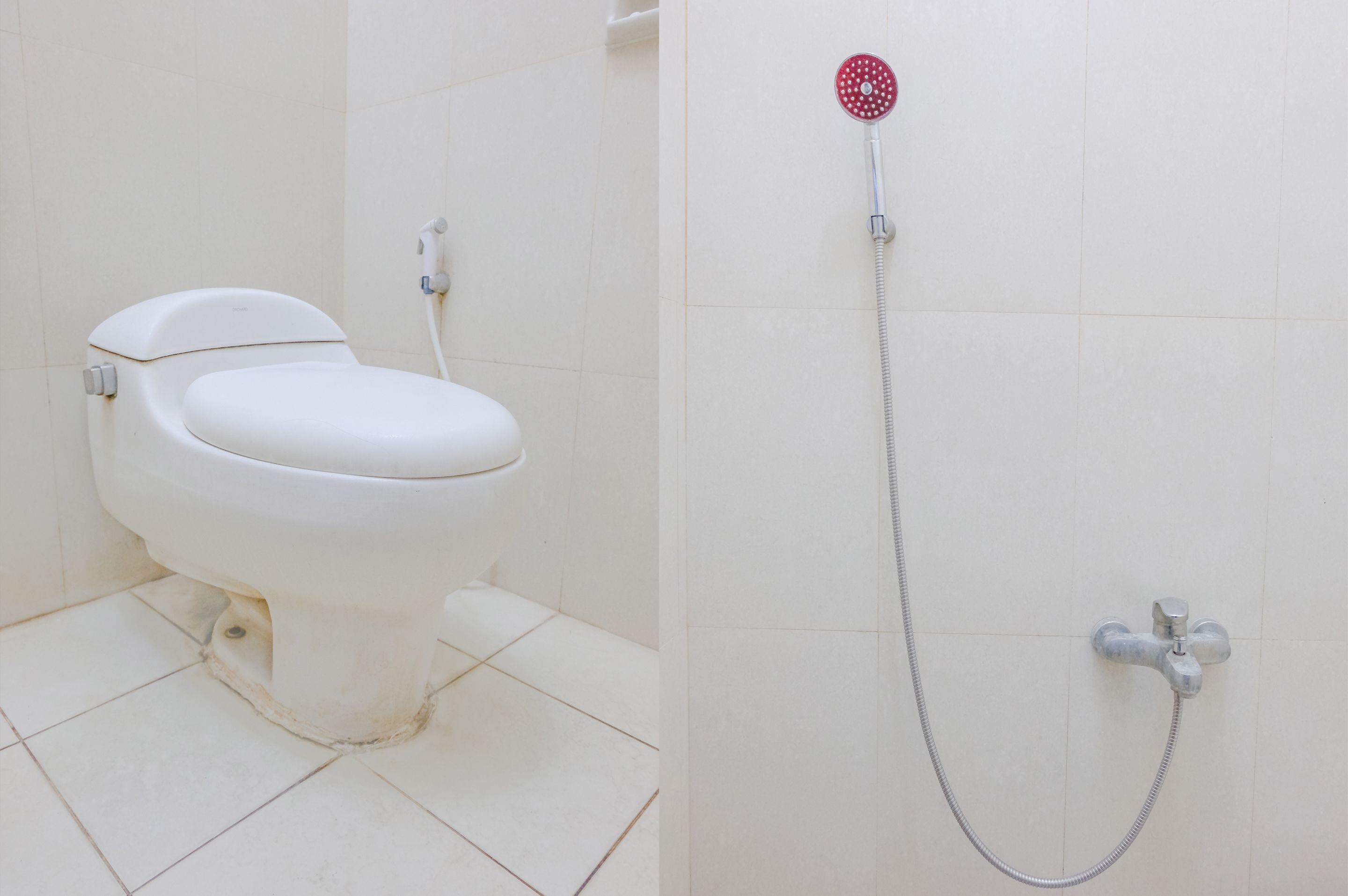 Un baño con inodoro, ducha y grifo en la pared.