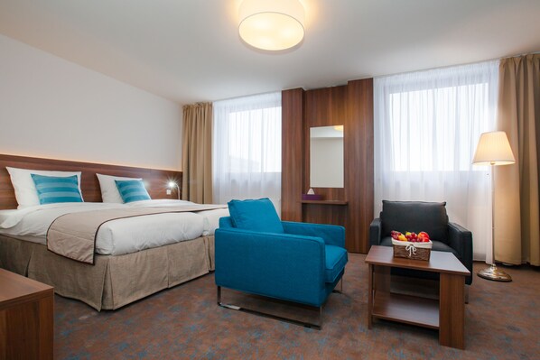 Exclusieve tweepersoonskamer | 1 slaapkamer, een minibar, een kluis op de kamer, een bureau
