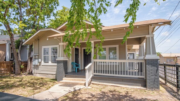 A two-story house with a front porch, a mailbox, and a number '918' on the front. - Renovated 2br/2ba Near Downtown (San Antonio)