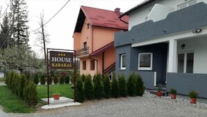 A two-story building with a sign reading "HOUSE KARAKAS". - House Karakas (Plitvicka Jezera)
