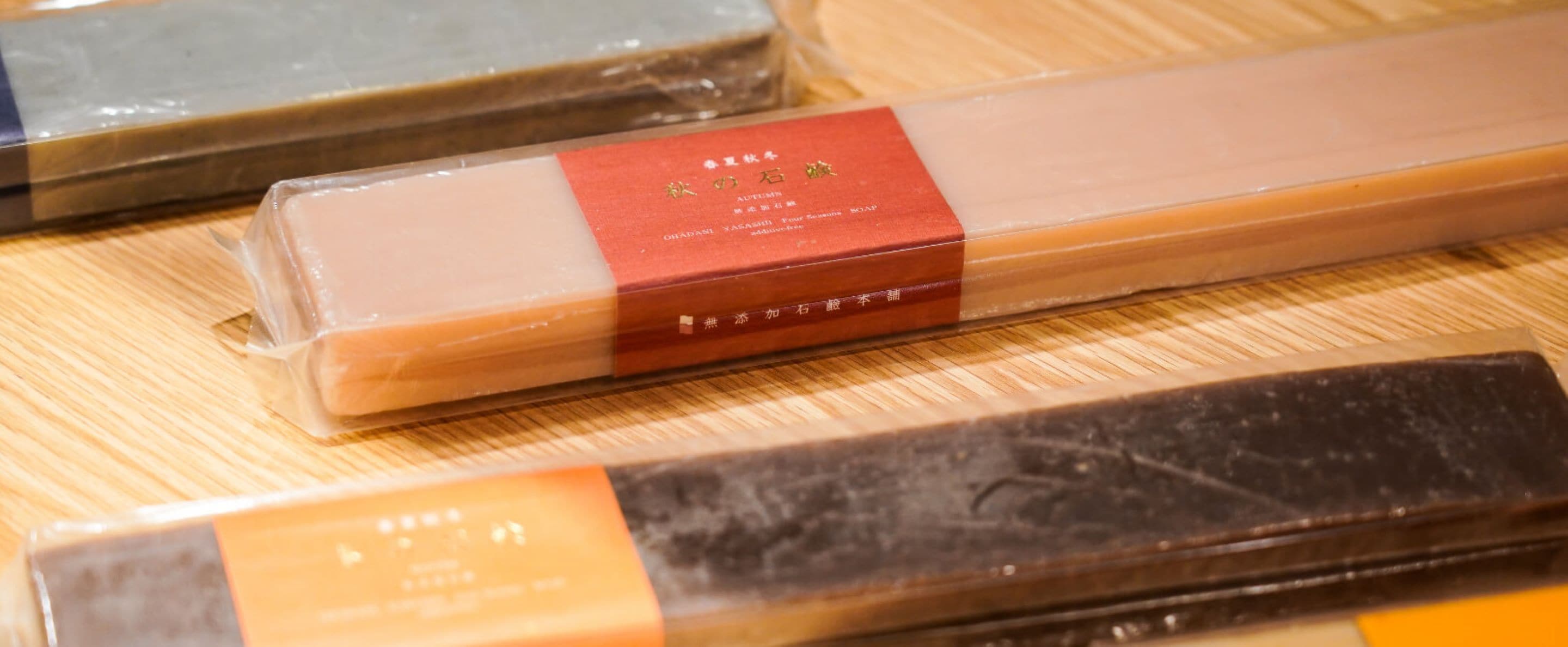 A variety of packaged items on a wooden surface.