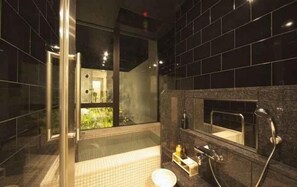 A modern bathroom with a glass shower enclosure, a built-in sink, and a large mirror. - Yugawara Onsen Chitose (Yugawara)
