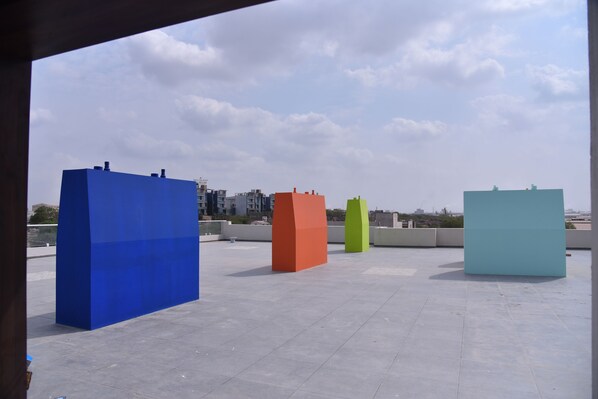 A rooftop with large, colorful geometric structures.