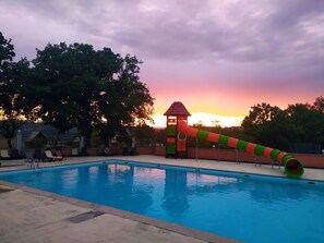 Seasonal outdoor pool, open 9:00 AM to 8:00 PM, pool loungers