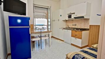 Apartment, 1 Bedroom | Private kitchen | Full-size fridge, microwave, stovetop, dishwasher