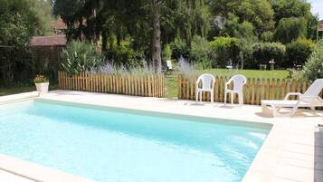 Seasonal outdoor pool, open 8:00 AM to 10:30 PM, pool umbrellas