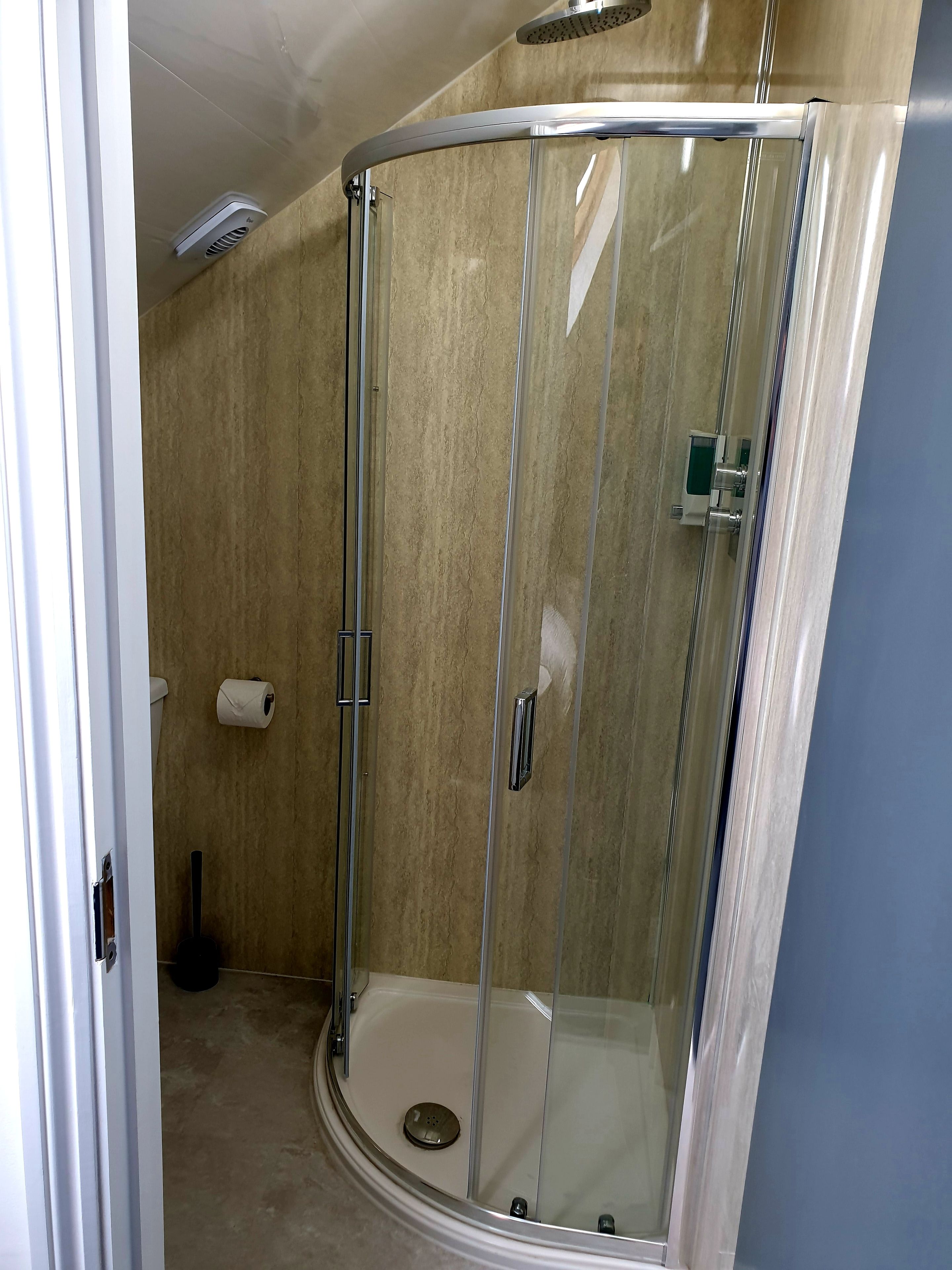 basic single room | bathroom | shower, towels, soap, toilet paper