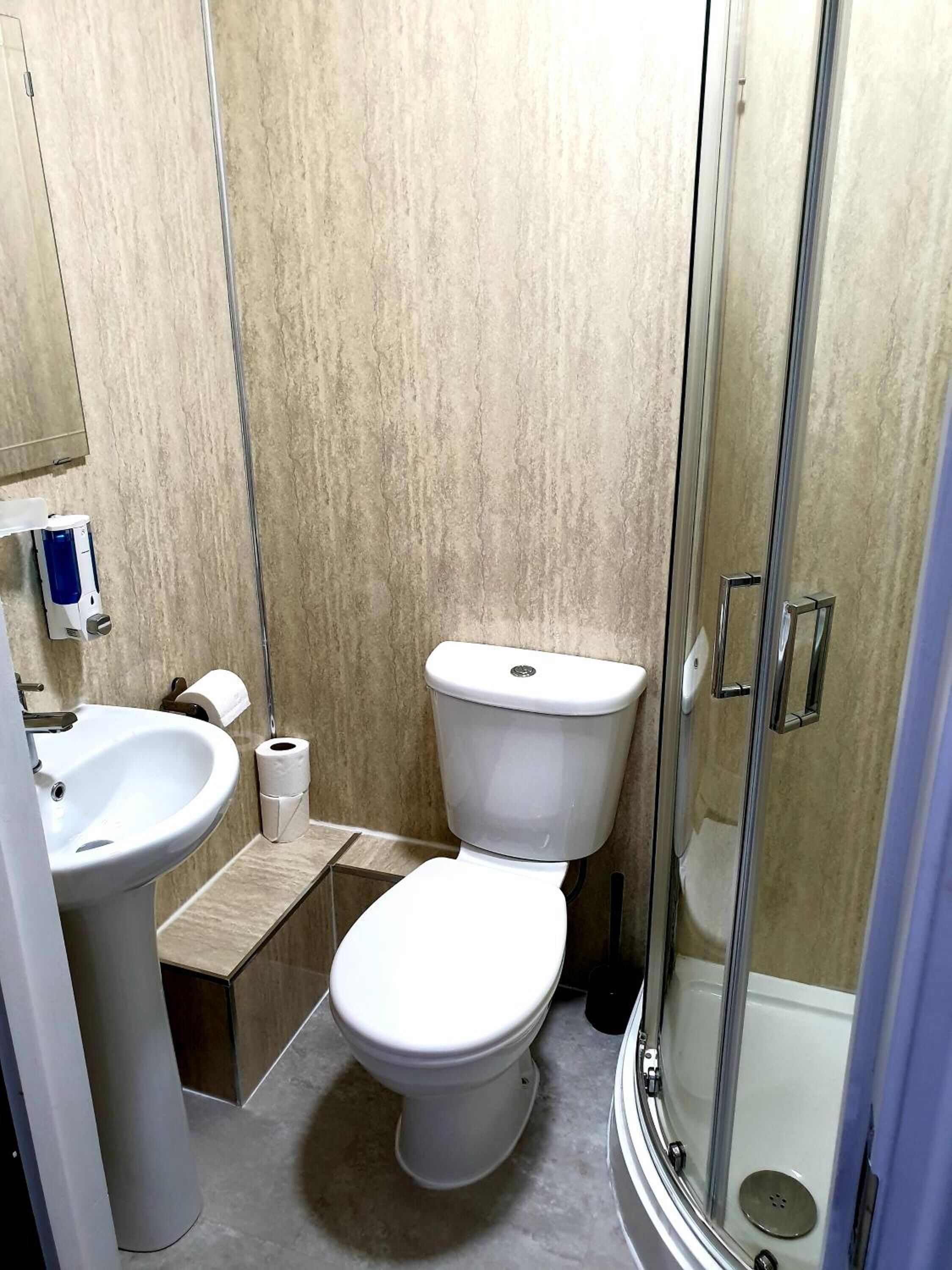 shower, towels, soap, toilet paper