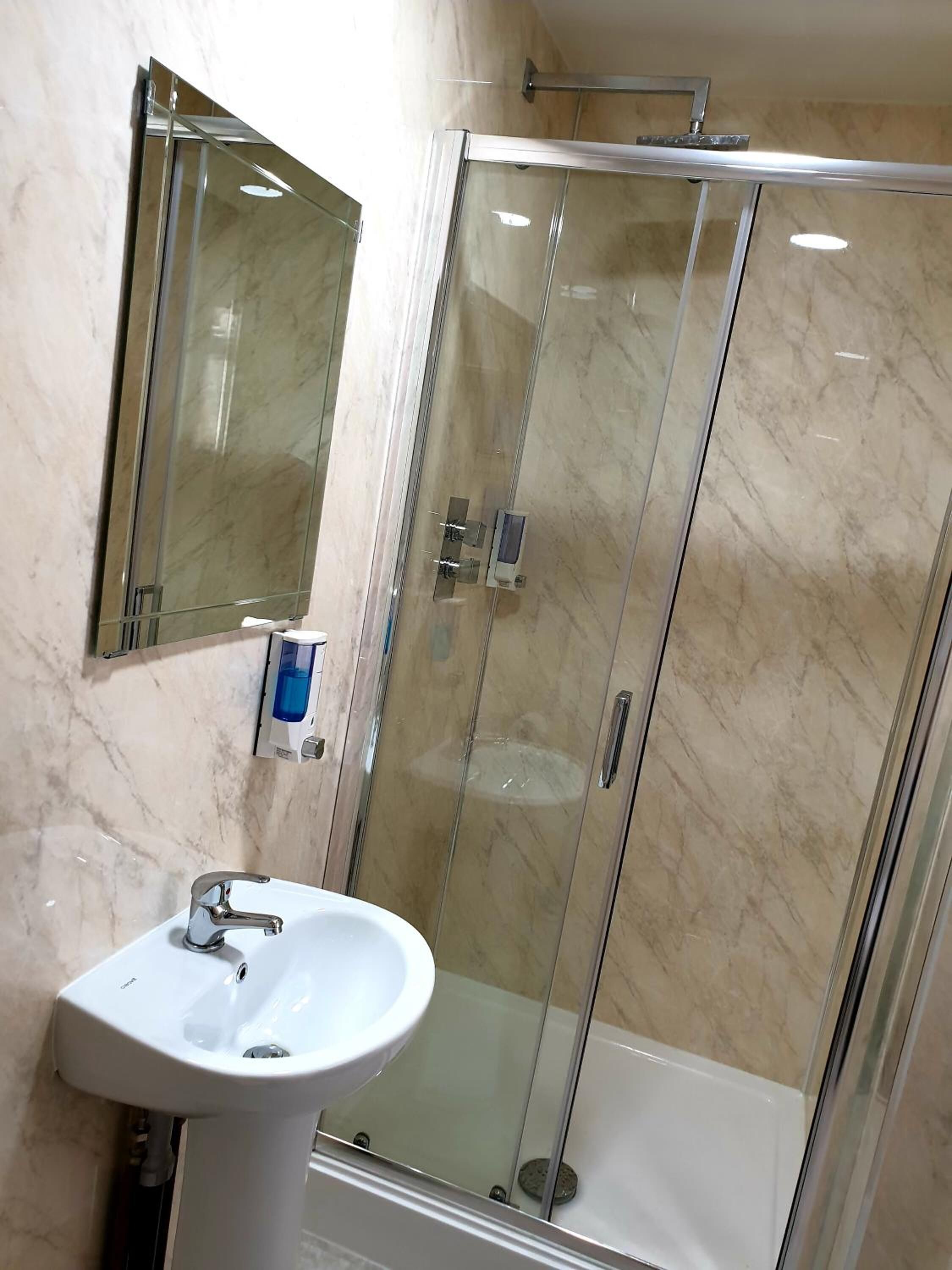 shower, towels, soap, toilet paper