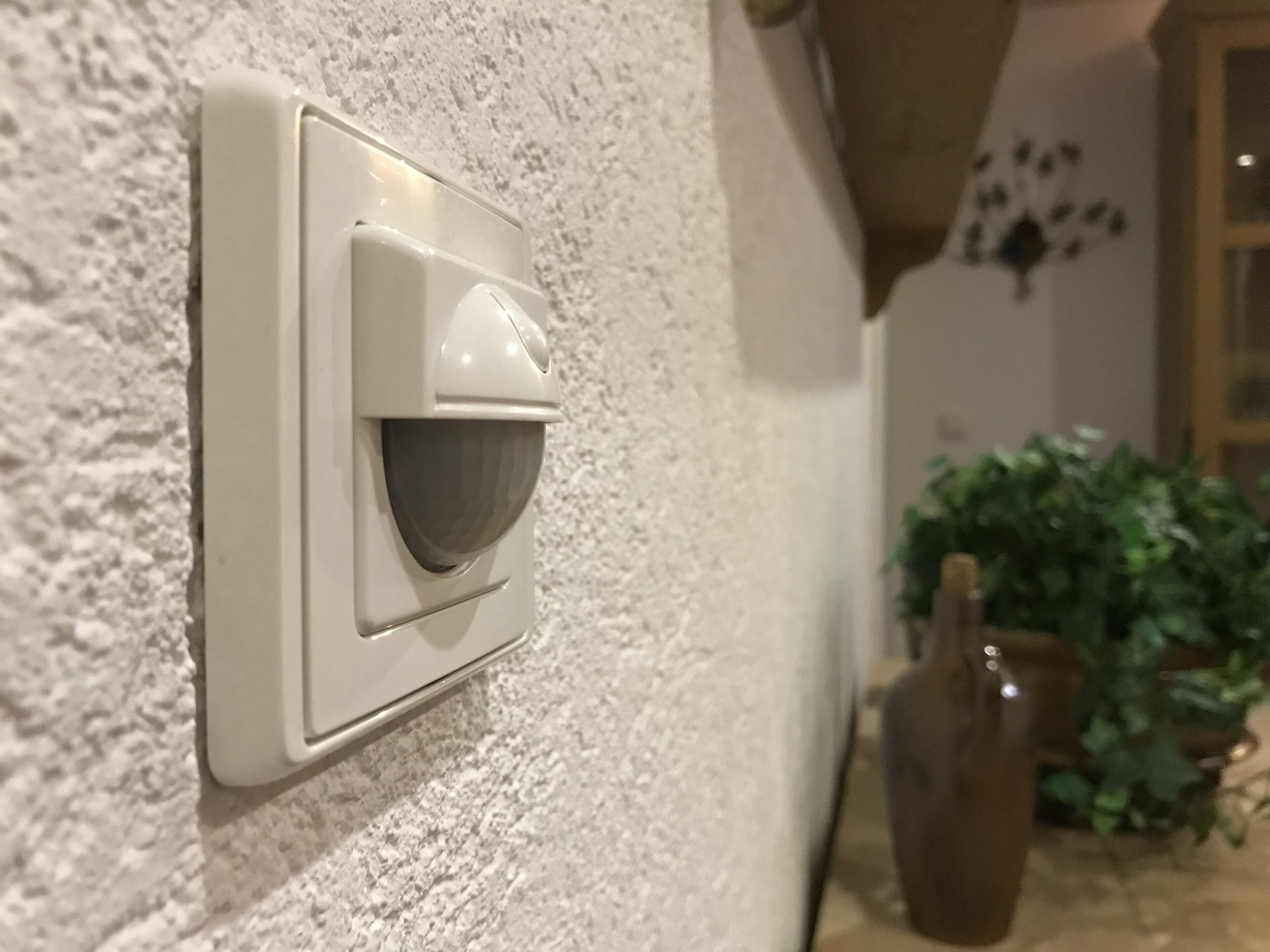 A wall-mounted security camera.